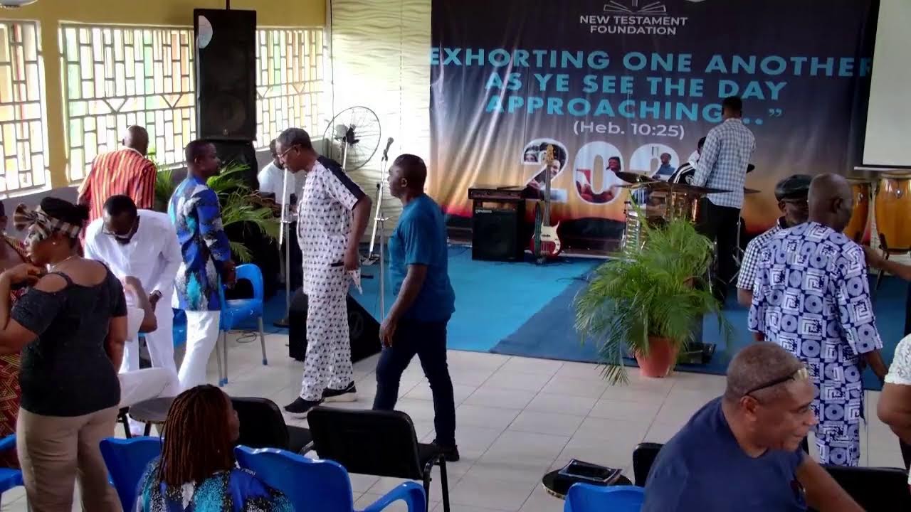 Members of New Testament Foundation talking and sharing fellowship after a church service.
